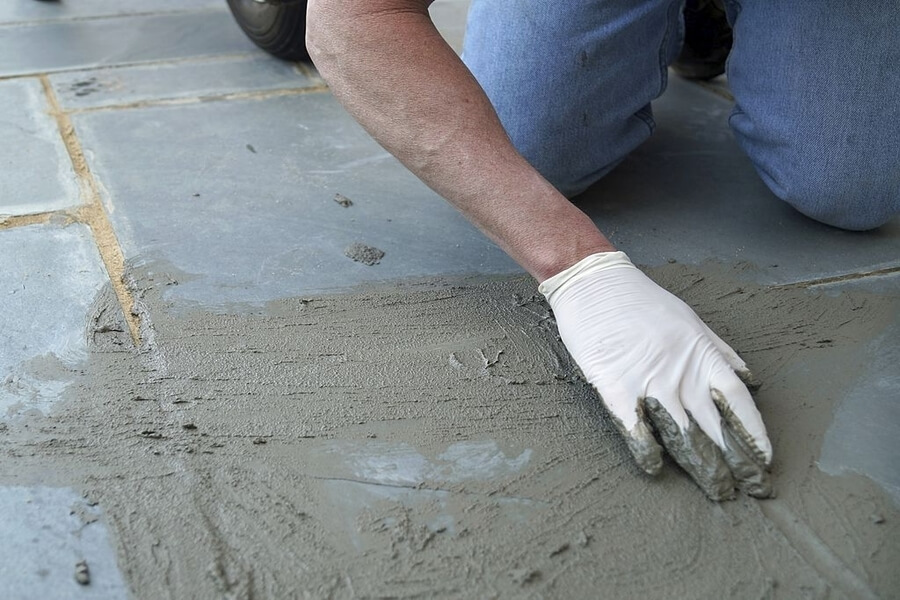 Man stamping the concrete